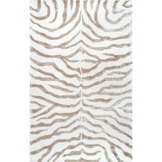 a white and brown rug with zebra stripes