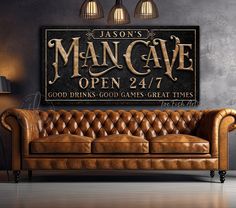 a leather couch in front of a man cave sign