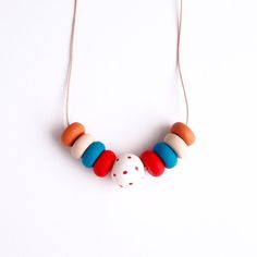 Red Dots - Handmade Clay Necklaces - Mixed Colors - Wearable Art - Jewelry - Unique Design - With Leather Cord Handmade Red Necklace For Everyday, Red Artisan Beaded Necklaces For Crafting, Artisan Red Beaded Necklaces For Crafting, Handmade Orange Necklace For Everyday, Red Round Bead Necklaces For Everyday, Everyday Handmade Red Necklaces, Everyday Red Round Bead Necklace, Everyday Red Round Bead Necklaces, Everyday Red Round Beads Necklaces