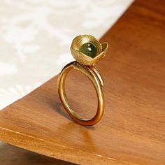 Small flower ring decorated with carnelian, jade or freshwater pearl, a bohemian style to dress every day. CHECK OUR PROFILE IF WE HAVE ANY OFFER OR CODE AVAILABLE! https://www.etsy.com/es/shop/AtelierBcnJoiaShop ► We know that this year the world is a little crazy. The online sales have made the normal shipping services collapse, so from the team of Atelier BCN Joia we wanted to make the effort and propose that buying 2 pieces we make you a FREE and extra FAST shipping with a private company. W Elegant Handmade Brass Flower Ring, Handmade Elegant Brass Flower Ring, Handmade Green Flower Ring For Weddings, Unique Gemstone Flower Ring For Wedding, Bronze Flowers, Olive Leaf Ring, Bohemian Jewels, Botanical Ring, Jewel Wedding