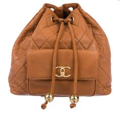 Caramel Quilted Leather Vintage Backpack With Gold-Tone Hardware, Dual Flat Shoulder Straps With Leather And Chain-Link Accents, Single Pocket At Front With Cc Turn-Lock Closure, Tonal Leather Lining, Dual Zip Pockets At Interior Wall And Drawstring Closure At Top. Includes Authentication Card. Purchased Off Trr Can Provide Reciept Good. Moderate Creasing And Scuffing Throughout Exterior; Moderate Scuffing At Lining. Vintage Chanel Bag, Brown Backpacks, Chanel Backpack, Vintage Backpacks, Bags Vintage, Brown Bag, Bratz Doll, Chanel Bags, Quilted Leather