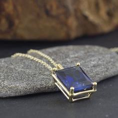 An Elegant and simply stunning gold Sapphire necklace. This handmade piece of jewelry is set with a 10x12 Sapphire corrndum (6.51ct minimum) in the deepest and most beautiful blue. The setting itself is vintage inspired in its simplicity and holds the stone securely whilst allowing for maximum light to enter the stone. Hangs from a strong yet dainty vintage inspired oval link chain. Making & Shipping of this piece: Each item is made to order, please allow 4-7 days in normal times and 5-11 da Sapphire Pendant Necklace With Diamond Cut, Pendant Necklace With Sapphire In Diamond Cut, Sapphire Birthstone Pendant Necklace, Classic Sapphire Pendant Necklace, Sapphire Diamond Cut Pendant Necklaces, Sapphire Pendant Birthstone Necklace For Gift, Gold Tanzanite Pendant Necklace, Sapphire Pendant Birthstone Necklace, Gold Sapphire Necklace For Formal Occasions