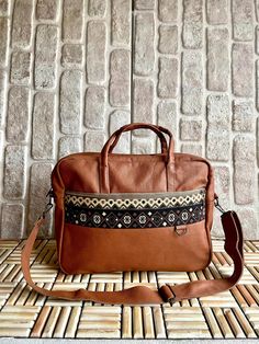 Rug patterned fabric detailed soft real leather brown cognac briefcase laptop bag. There are 8 separate organizer pockets. You can carry all your documents, laptop and daily belongings together. It has separate compartments for laptop, business cards and documents. There are even small pockets specially designed for you to put your fountain pens inside the bag. These laptop briefcase is durable and high quality with lining inside for soft protection. It is a gorgeous gift for birthday, new year Working Office, Laptop Business, Boho Tote Bag, Boho Tote, Design Bag, Laptop Briefcase, Leather Rug, Office Bag, Sister Wife