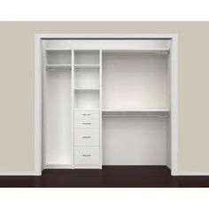 an empty white closet with drawers and shelves