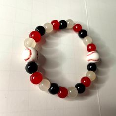 Handmade Elastic Red, Black, And White Bracelet With Baseballs On It Perfect For Any Arizona Diamondbacks Fan Or Any Baseball Mom Or Fan One Size Fits Most Brand New, Never Worn Ships Within 1-2 Days B202 Casual Black Wristband, Casual Black Handmade Wristband, Casual Red Beaded Bracelets With Black Beads, Trendy Handmade Black Stretch Bracelet, Trendy Black Handmade Stretch Bracelet, Handmade Casual Black Bracelets, Casual Handmade Black Beaded Bracelets, Casual Black Handmade Bracelets, Casual Handmade Black Bracelets