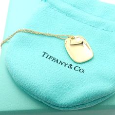 About This Piece: Metal: 18k Yellow Gold Pendant Size: 16mm x 20mm Weight: 8.7 grams Length: 15.5" Total, 15" Chain Hallmarks: Tiffany & Co Elsa Peretti 750 Spain 3017aed Luxury Necklaces With Rectangular Links For Gift, Designer Yellow Gold Necklace With Polished Finish, Designer Yellow Gold Necklaces With Polished Finish, Designer Gold Necklace With Polished Finish, Designer Yellow Gold Polished Necklace, Luxury Gold-plated Necklace With Rectangular Pendant, Luxury Yellow Gold Oblong Jewelry, Luxury 14k Gold Necklace With Shiny Finish, Formal Hallmarked Necklace With Rectangular Pendant