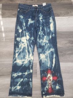 One of a kind Levi's bleached, hand painted and distressed medium washes jeans. These jeans are comfortable and a perfect fit! They pair perfect with a crop top, bodysuit, T-shirt or crewneck.  SIZE: 12M Fitted Distressed Flare Jeans For Streetwear, Summer Streetwear Cotton Flare Jeans, Summer Streetwear Flare Jeans, Spring Acid Wash Denim Flare Jeans, Fitted Faded Cotton Flare Jeans, Trendy Fitted Faded Jeans, Denim Pants For Summer Festivals, Medium Wash Distressed Cotton Flare Jeans, Distressed Medium Wash Cotton Flare Jeans