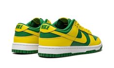 The Nike Dunk Low “Reverse Brazil” is a two-tone, yellow-and-green colorway of the retro basketball shoe that flips the color scheme of the model’s popular “Brazil” style.  As its name suggests, the “Reverse Brazil” reverses the color coordination of the “Brazil” Dunk, and it doesn’t miss the mark.  The shoe features Yellow Strike leather overlays and Swoosh branding on an Apple Green-colored leather base.  A green “Nike” logo is embroidered on the yellow leather heel tab.  Classic “Nike” detail Nike Dunk Low Reverse Brazil, Yellow And Green Dunks, Green And Yellow Sneakers, Green And Yellow Shoes, Reverse Brazil Dunks, Hard Shoes, Brazil Style, Adidas Sl 72, Outfit Sneakers