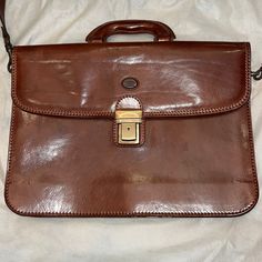 New Made In Italy Brown Genuine Leather Messenger Bag. 15” X 11”. Expandable 1 1/2” To 2 1/2”. Inside Divided Compartments, Zipper Pocket, Card And Pen Holder. Handle And Removable 18” Strap. Antique Brass Hardware With Closure And Key. Storage Bag Included. Purchased In Florence Italy. Designer Brown Bags For Business Trips, Classic Office Laptop Bag With Removable Pouch, Classic Briefcase With Removable Pouch For Work, Timeless Formal Shoulder Bag Briefcase, Timeless Formal Shoulder Briefcase, Designer Brown Satchel For Business Trips, Designer Office Briefcase Shoulder Bag, Elegant Brown Shoulder Bag Briefcase, Designer Formal Shoulder Briefcase