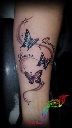 a woman's arm with two butterflies and the words you are loved on it