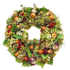 a wreath made out of leaves, apples and other flowers on a white background with the letter o in the center