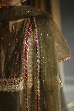 Editor's Note Featuring Straight Kurta Set with Mirror Work, Hand Embroidered Floral Bootis, Hand Sequinned Embroidery Color: Olive Fabric: Chanderi Zari - Kurta, Zari Organza - Dupatta, Chanderi Zari -Pants, Mulmul Slip Care: Dry Clean Only About the Designer Begum celebrates heritage and rare craftsmanship on traditional silhouettes. Our pieces can be best defined as summer personified with artisanal hand embroideries, hand appliqués and ancient techniques revived in the present day hand looms Diwali Organza Kurta With Embroidered Border, Organza Straight Kurta With Embroidered Border, Designer Organza Kurta With Embroidered Border, Unstitched Organza Kurta With Embroidered Border, Traditional Organza Kurta With Embroidered Border, Designer Gold Sharara With Embroidered Border, Fitted Embroidered Sets In Tissue Silk, Gold Dola Silk Sets With Embroidered Border, Festive Gold Sharara With Embroidered Border