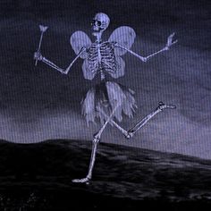 a skeleton is dancing in the dark