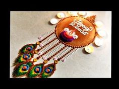 a decorated brooch sitting on top of a table next to some candles and buttons