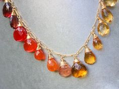 THE JEWELRY IS SHIPPED via DHL EXPRESS (2-5 days delivery door to door). THE DHL SHIPPING COST IS INCLUDED IN THE PRICE. The Sunset Necklace - Solid Gold 14K Multi Gemstone Orange Red Drop Necklace, Semi Precious Colorful Necklace ► Measurements / Details: - Necklace Length: Made to Order - Gold: High quality Gold Filled - Silver: High quality Sterling Silver ► Gemstones: The necklace includes excellent AAA quality precious gemstones: ~ Scapolite ~ Lemon Quartz ~ Citrine in several shades ~ Hone Sunset Necklace, Gemstone Jewelry Earrings, Semi Precious Necklace, Multi Gemstone Necklace, Colorful Necklace, Rainbow Gemstones, Garnet And Gold, Precious Gemstones Jewelry, Rainbow Jewelry