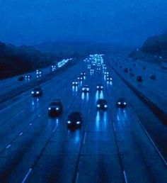 a highway filled with lots of traffic at night