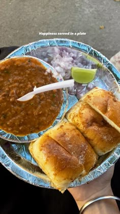 a person holding a plate with some food on it