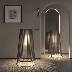 two lamps sitting next to each other in a room