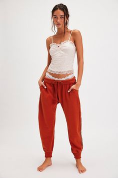 Totally chill in every way, these joggers from Intimately are featured in a harem style with a fold-down waistband and sporty side-stripe detailing. **Fit:** Relaxed, low-rise **Features:** Comfy, terry-lined fabrication, stretchy fold-down waistband, adjustable drawcord, drop-crotch silhouette, cinched cuffs, raw seams, side pockets, side-stripe detail **Why We | Going For It Lounge Joggers by Intimately at Free People in Orange, Size: XS Side Stripe, Small Waist, Boho Outfits, Low Rise, Heather Grey, Cinnamon, Free People, Lounge, Size Medium