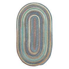 the oval rug is made from multicolored yarn and has an oval design on it