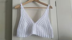 Hand made crocheted summer crop top in white size approx. S (8/10 UK or 36/38 Euro) yarn: 100% acrylic, silk and mercerised look Note - colours may vary slightly from monitor to monitor. All of my items are created & stored in a smoke free, pet free environment. I ship my items via regular post. Please let me know if you want a shipping upgrade. Please convo me if you need different size or colour. Thanks! ♥ Crochet Lace V-neck Crop Top For Summer, Summer V-neck Crochet Crop Top, Festival Crochet V-neck Crop Top, White V-neck Crop Top For Summer, White V-neck Summer Crop Top, White Crochet Triangle Top For Summer, Summer V-neck Crochet Lace Crop Top, White Crochet Trim Triangle Top, White Bohemian Crop Top With Crochet Trim