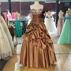 Ball Gown With Pleated Skirt, Bedazzled Chest Ruffled Waist, Lace Up Back, Strapless Brown Quince Dress, Brown Ball Gown, Castle Hallway, Silver Metallic Dress, Fall Ball, Cap Sleeve Gown, Prom Dress Color, Graduation Party Dresses, Blue Sequin Dress