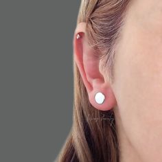 "Cute plain handmade circle studs have been crafted from 925 solid sterling silver with a polished finish that adds glamour to any look.  These dainty and simple round sterling silver post pin earrings are the perfect accessory for everyday use. ⭐ Sterling Silver Option >> Made of solid 925 Sterling Silver Gold Filled Option >> 18K Gold filled over solid 925 Sterling Silver Rose Filled Option >> Rose Gold filled over solid 925 Sterling Silver  ⭐ Price is for a pair stud earrings. Each pair comes with sterling silver butterflies stamped 925 Disk Diameter > 4/1\" (7mm) Disk Thickness > 3/64\" (1.1mm) Post Length > 3/8'' (10mm) Post Thickness > 20ga (0.8mm) Backing Type > Push Back For more stud earrings ⭐ https://etsy.me/3wGtQ1p For more similar items visit my shop. ⭐️ https://etsy.me/3nnxsB Silver Ear Climbers, Crawlers Earrings, Pin Earrings, Tiny Studs, Tiny Stud Earrings, Small Earrings Studs, Circle Studs, Earrings Small, Silver Prices