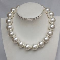 Welcome back to my shop: https://www.etsy.com/shop/pearlandjewelry Description of the product in the picture: This necklace with  20 mm  ivory color plastics pearl beads. The length of the necklace is 16 inches.You can choose the length when you order.and the necklace with a lobster clasp and it still has a 2 inch long adjustable chain. If you need the other lengh or size ,Please feel free contact me. Thank you so much, :) Big Pearl Necklace, Necklace Big, Pearl Necklace Wedding, Big Pearl, Necklace Wedding, Necklace Pearl, Wedding Jewellery Necklace, Necklace Choker, Ivory Color