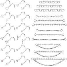 a bunch of different types of piercings on a white background with chains and hearts