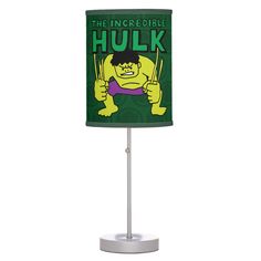 the incredible hulk lamp on a white base with green and yellow fabric shade, which reads hulk