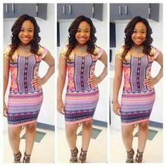 the woman is wearing a colorful dress and smiling while posing for pictures in front of a white wall