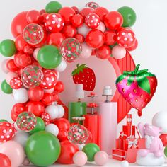 a bunch of balloons that are in the shape of a strawberry and some other items