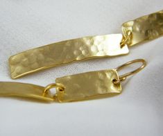 "A beautiful two curved hammered rectangles earrings Unique and elegant earrings made from 24K gold plated combined with goldfilled earwire. Rectangular plate width ~1/4\" (7mm) Total Length: ~ 2 1/4\" (5.5cm) Look at my shop for other items of my my \"gold rectangulars\" collection: https://www.etsy.com/listing/172537298/hammered-rectangle-earrings-gold-bar https://www.etsy.com/listing/96554254/gold-stick-earrings-gold-bar-earrings https://www.etsy.com/listing/95446232/rectangle-earrings-hammer Gold Hammered Rectangular Earrings, Earrings Gold Long, Gold Long Earrings, Gold Bar Earrings, Stick Earrings, Long Gold Earrings, Rectangle Earrings, My My, Hammered Gold