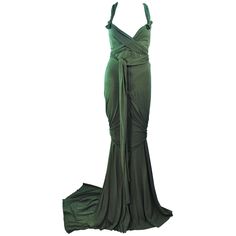 This Elizabeth Mason Couture gown is composed of bamboo jersey. Features a wrap style with a drop neckline. may be fashioned in a variety of colors. The gown may be fashioned in a variety of colors. This is a couture custom order. Please allow for a 60 day lead time from measurements, fabric selection, patterning, toile fitting, to final product. The dress shown is a sample size 2. The sample is not for purchase. Measurements of sample size: Length: 55" +10" Train Bust: 30" Waist: 26" Hip: 38" Blue Couture Gowns, Black Dinner Dress, Blue Velvet Gown, White Jersey Dress, Drape Gown, Drapey Dress, Jersey Evening Dress, Vintage Evening Gowns, Gowns Black