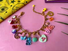 💖 Customized bracelet with charms of different motifs. This is a unique and limited edition piece, made with lots of love 💖.  DETAILS: * I used acrylic, fimo or metal charms * Gold-plated steel trimmings * Hook clasp * Adjustable * NOT recommended to wet Shipping: Once the order is placed, it takes 1-3 business days to prepare it before it is shipped. The order will be sent by registered mail, you will receive a tracking number with which you can see where your order is at any time :) Cute Multicolor Personalized Charms, Pink Dangling Charms For Friendship, Fun Pink Bracelets With Charms, Pink Fun Charm Bracelet, Cute Multicolor Jewelry With Removable Charms, Cute Friendship Dangling Charms, Playful Pink Charm Bracelets, Trendy Personalized Bracelet Charms, Trendy Personalized Charms