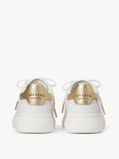 we call these our lift sneakers for a reason: the platform midsoles will add a little bit of height plus the supple nappa leather with pops of print and color will instantly elevate any outfit you pair them with. | Kate Spade Lift Sneakers, Optic White/Pale Gold - 11 Designer Leather Sneakers With Laces, Spring Leather Lace-up Shoes With White Sole, Chic Lace-up Sneakers With Rubber Sole, Modern Spring Sneakers With Leather Sole, Designer Leather Sneakers, Modern Leather Sole Sneakers For Spring, Elegant Lace-up Sneakers With White Sole, Designer Leather Sole Lace-up Sneakers, Designer Lace-up Sneakers With Leather Sole