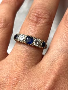 Gorgeous Art Deco French 18k Gold Engraved Sapphire & Diamond Ring with natural Sapphires and old mine Diamonds. This treasure was acquired in France, it has gorgeous engraving all around it and on both sides. The stones are beautiful and sparkling, a very fine quality and example from the Art Deco era. It is hallmarked with the French eagle's head (for 18k gold purity).  US size: 6 3/4 (it can be resized upon request) Weight: 4.8 grams Excellent antique conditions. Thank you for visiting Boudoi Classic Multi-stone Sapphire Ring With Diamonds, Antique Oval Sapphire Diamond Ring, Victorian Sapphire Ring With Diamond Oval Shape, Victorian Oval Sapphire Ring With Diamond, Sapphire Multi-stone Oval Diamond Ring, Oval Sapphire Multi-stone Diamond Ring, Diamond White Multi-stone Sapphire Ring, Oval Multi-stone Sapphire Diamond Ring, Anniversary Sapphire Diamond Ring With Multi-stones