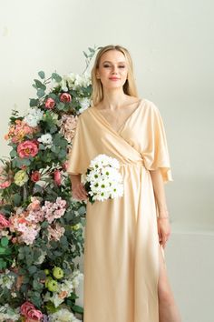 "Silk Toga Dress in Greek style. The dress was created from soft fabric with silk texure. Draped front style inspired by ancient Greek and Roman toga fashion. Due to the fabric, it is extra light and comfy to wear in the hot season. The design is very light and airy. A bit oversized cut is a great fit for the modest and ladylike image. The ruffle back with a V cut creates a delicate accent. Comfy to wear, move and dance. It is also festive and modest and suits for visiting the church ceremonies V-neck Maxi Dress For Wedding Night In Spring, Elegant Fairy Dress For Bridesmaids In Spring, Elegant Spring Fairy Dress For Bridesmaids, Elegant Summer Bridesmaid Fairy Dress, Flowy Draped Maxi Dress For Wedding, Flowy Wrap Evening Dress, Evening Flowy Faux Wrap Dress, Flowy Wrap Dress For Evening, Flowy Faux Wrap Evening Dress