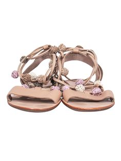 Elevate your boho look this summer with these sandals from Loeffler Randall! These strappy sandals feature adorable baubles and are perfect for any casual outing or even a music festival! Pair with a sundress and hobo bag for a hippie chic look. Size 7 Leather upper w/ strappy design Pink, green, tan and white baubles on straps Slip on closure w/ ties Leather sole and footbed w/ minor wear on toes Original dustbag included Length 9.5" Bohemian Flat Lace-up Sandals For Beach, Beige T-strap Sandals For Summer Beach, Summer Vacation Lace-up Sandals With Open Heel, Beige T-strap Sandals For Summer Vacation, Bohemian Adjustable Flat Lace-up Sandals, Adjustable T-strap Sandals With Flat Heel For Vacation, Bohemian T-strap Sandals For Summer, Casual Toe Ring Sandals With Ankle Strap For Vacation, Spring Open Toe Lace-up Sandals With Adjustable Strap