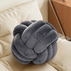 a pillow that is on top of a couch