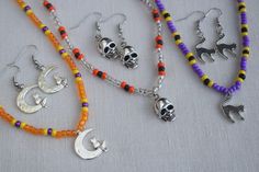 Halloween necklaces, bracelets and earrings are fun and unique and make a great addition to any Halloween costume. They are very nice and well made so you can wear them out or to the office to show that you are in the Halloween spirit. This jewelry set will also make a wonderful gift or party favor for Halloween. The beaded necklaces and bracelets are made with stretchy beading cord so you have a little flexibility in fit. I can add a chain extension if you need more length. You custom order you Fun Silver Metal Jewelry, Handmade Jewelry For Halloween Party, Handmade Halloween Party Jewelry, Halloween Themed Jewelry For Costume Party, Themed Jewelry For Halloween Costume Party, Themed Metal Jewelry For Halloween, Fun Handmade Metal Jewelry, Handmade Fun Metal Jewelry, Handmade Jewelry For Halloween Costume Party