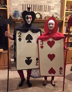 two people dressed up as playing cards and clowns