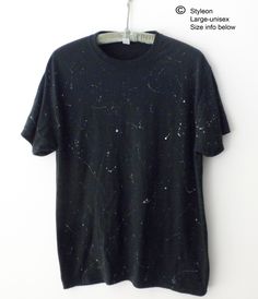 NEW Hand painted white and gray paint splatters on a black tee shirt, inspired by shooting stars. The manufacture of the original Tee shirt is JERZEES, 50% cotton/50% Polyester.  SIZE LARGE Unisex(Men's):   Approx. dimensions according to Jerzees are as follows: Width across the chest  is approx. 22inches, and  Length  is approx. 30 inches. More T-Shirts: https://www.etsy.com/shop/Styleon I try is get the colors as close to actual. Please note every computer monitor is different. Washing Instructions:  This tee has been washed since it was painted and is ready to wear!  Next time, turn inside out and wash in cold water, gentle cycle, then tumble dry low.  Do not iron. Black Cotton T-shirt With Paint Splatter, Bleached Black T-shirt For Streetwear, Relaxed Fit Paint Splatter T-shirt With Crew Neck, Black Casual T-shirt With Star Print, Black Star Print Casual T-shirt, Grunge Style Star Print T-shirt For Summer, Summer Grunge Star Print Top, Black Cotton Tops With Star Print, Black Cotton Top With Star Print