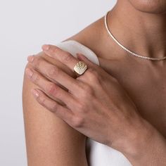 Our gleaming Suburst Cushion signet ring in 14k yellow gold, from Stardust by G.St. glows with a beautiful satin finish and showcases a display of flush set round brilliant diamonds, taking your ensemble from simple to stunning. • 14k yellow gold with satin finish • 0.52tcw round brilliant diamonds (G-H color, SI clarity) • Band width: 14mm, band thickness: 2mm • In stock in size 6.5. Additional sizes will be made to order. Minimalist Diamond Signet Ring With Polished Finish, Modern Diamond Signet Ring For Formal Occasions, Minimalist Diamond Ring For Everyday Luxury, Modern Brilliant Cut Dome Ring For Formal Occasions, Minimalist Everyday Diamond Rings, Minimalist Everyday Luxury Diamond Rings, Modern Diamond Dome Ring For Formal Occasions, Minimalist Signet Ring With Brilliant Cut For Formal Events, Minimalist Brilliant Cut Signet Ring For Formal Occasions