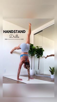 a woman doing a handstand in front of a mirror with the words, handstand drills