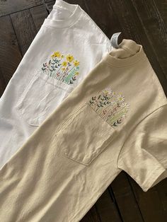 Machine embroidered flowers sprouting from the pocket of these (Gildan 6 oz., 100% preshrunk cotton, unisex) tees, offered in colors white and sand. Perfect for Spring and Summer! This is a Made-To-Order item and will take 1-2 weeks to process. *Note- thread colors may vary! Floral Pocket, Thread Colors, Green Diamond, Pocket Tee, Embroidered Flowers, Friends In Love, Graphic Tees, Thread, Adult Outfits