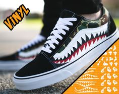 "Shark Vans Vinyl Stencil Available in 2 sizes: S, M. Small (works best Kids/ Womens sneaker sizes) Medium (works best for Mens sneaker sizes) You will receive one full 12\"x12\" wide sheet of vinyl. This sheet will contain all the stencils needed to complete one pair of the Shark Vans as you'll see in our video below! Incredibly easy to use and we have everything laid out cleanly for customizers of any experience to tackle this project. Ready to ship in 2 - 3 business days To see the stencil in Bape Vans, Camo Stencil, Camo Vans, Cool Vans Shoes, Chitenge Outfits, Customize Shoes, Vans Shoes Women, Bape Camo, Bape Shark