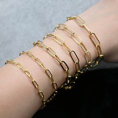 "Embrace modern elegance with our stunning 14K Solid Gold Paperclip Chain Bracelet. This unique piece combines minimalistic design with luxurious materials, resulting in a bracelet that exudes sophistication and style. These Bracelets are 100% Authentic 14K Solid Gold \"Not Plated or Filled\"  -Material: 14K Real Solid Gold -Polished Average Weight Based on 7.5\" 4mm - 2.25 grams  4.3mm - 2.38 grams 5.8mm - 3.75 grams  6.2mm - 2.80 grams  6.6mm - 2.90grams  7mm - 3.68 grams Length: Selectable Wi Real Gold Bracelet, Gold Arm Band, Paperclip Bracelet, Luxury Rings, Average Weight, Modern Necklaces, Classic Jewelry, Minimalistic Design, Gold Polish