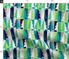 an image of a green and blue fabric with trees on it, as well as numbers