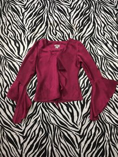 "90s Vintage Bell Sleeve Ruffle Blouse in Shiny Deep Magenta Color I'm in love with this beautiful, romantic style magenta blouse! Ruffle accent down the front and flowy bell sleeves. Reminds me of a medieval style sleeve. Gorgeous deep purple, magenta jewel tone color. The fabric is a polyester but has a sheen to it like a polyester taffeta. This color photographs as a red wine tone but in real life there's a little more purple in it. Made in USA Brand: J.B.S. Ltd Tag Size: Small Measurements ( Magenta Blouse, Deep Magenta, Magenta Color, Medieval Style, Vintage Bell, Medieval Fashion, Outfit Combinations, Retro Shirts, Fashion Design Clothes